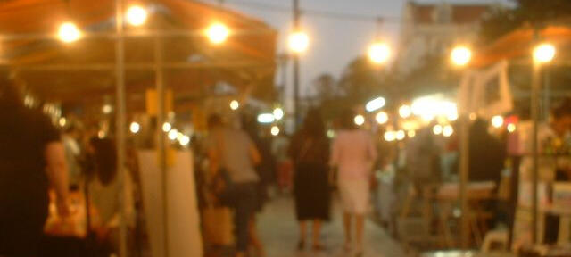 a photograph of sunlight peeking through green leaves